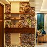 Unique Brick Themed Foyer Area - Livspace