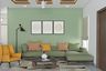 Green Living Room Design With L-Shaped Sofa And Bright Yellow Accent Chair - Livspace