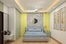 Spacious Master Bedroom Design In Yellow & Grey Shades - Livspace