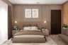 Master Bedroom With Tufted Beige Backpanel - Livspace