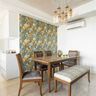 7x9  4-Seater Dining Room Design With Grey Velvet Chairs And Abstract Multicoloured Wallpaper - Livspace