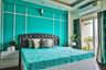 9x8 Ft Turquoise Guest Room Design With Queen-Sized Bed And Grey Tufted Headboard - Livspace