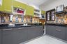 10x8 Ft River Stone Base and Golf Green Wall Units in Contemporary U-Shaped Modular Kitchen with Granite Countertop - Livspace