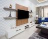 Walnut Bronze And Frosty White TV Unit Design With Geometric Wallpaper - Livspace