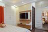 Persian Walnut Wall-Mounted TV Unit Design With Drawers And Ledges - Livspace