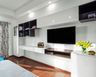 Wall-Mounted Cherry Walnut And Frosty White TV Unit Design - Livspace