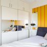 Mirrored White Sliding Wardrobe Design With Yellow Panelling For The Wall - Livspace