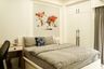 Guest Bedroom Design with Panel Moulding, White Wardrobe and Wooden Wall Art