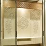 Pooja Design with Floating Cabinets, Om Motif Backlighting and Lotus Cutwork