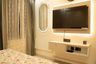 Cream and Wood Floating TV Unit Design with Backlit Panel and Matte Finish