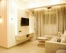 Beige and Wood Floating TV Unit Design with Concealed Storage and Marble Back Panel