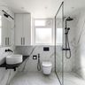 Bathroom Design with White Marble Tiles and Black Fixtures