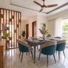 Dining Room Design with Wooden Slatted Divider and Fluted Table