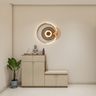 Foyer Design with Futuristic Circular LED Wall Sculpture and Bench