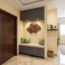 Foyer Design with Cushioned Bench and Fan Metal Sculpture