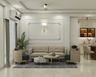 Living Room Design with Geometric Wall Molding and Tub Armchairs