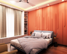 Modern Bedroom with Orange Tones - Livspace