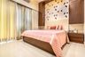 Pink Guest Bedroom Design With Patterned Bird Wallpaper And Wooden Panels - Livspace