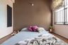Kids' Room With A Low-Height Bed And Brown Wall Panelling - Livspace