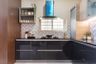 L-Shaped Kitchen Design With Wall Storage - Livspace