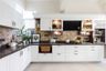 L-Shaped Kitchen With A Bar Unit - Livspace