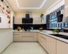 Beige L-Shaped Kitchen Design - Livspace