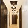 Wood And Gypsum Coffered False Ceiling Design With Drop Down Lights For Foyer - Livspace