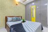 Guest Bedroom With Wooden Bed, 4-Door Grey And Yellow Swing Wardrobe And Mosaic Wallpaper - Livspace