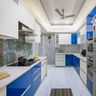 Parallel white and blue modular kitchen design with false ceiling - Livspace