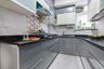 U-Shaped Grey And White Modular Kitchen With White And Multicoloured Dado Tiles - Livspace