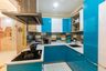 U-Shaped Glossy White And Blue Compact Kitchen With Multicoloured Dado Tiles - Livspace