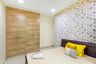 Kids Bedroom Design With Modern Wooden Bed, Abstract Multicoloured Wallpaper And 4-Door Wooden Swing Wardrobe - Livspace