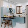 U-Shaped Light Blue Kitchen Design With Black Countertop And White Loft Storage - Livspace