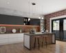 Spacious Open Kitchen Design With Kitchen Island, Black And White Kitchen Cabinets, Wall Ledges, Wooden Flooring And Red Brick Rustic Accent Wall - Livspace