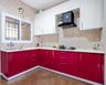 Red And White L-Shaped Kitchen Design