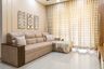 A Beige Living Room With L Shaped Sectional Sofa - Livspace
