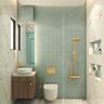 Light Green Bathroom Design With Wooden Vanity Unit, Brass Fittings and Quartz Countertop - Livspace