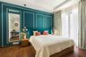 Spacious Master Bedroom Design With Spacious Queen Size Bed And Teal Headboard, With Teal Blue Accent Wall And White Wall Trims - Livspace