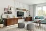 Contemporary TV Unit Design With Wood And White Storage, Wall Shelves, Open Wall-Mounted Unit And Light Blue Sofa - Livspace