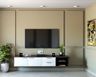 Wall-Mounted Dark Wood And White TV Unit Design Against A Light Brown Panelled Wall, A Potted Plant And An Adjacent Abstract Painting - Livspace