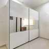 2-Door Modern White Sliding Wardrobe With Mirror Panel - Livspace