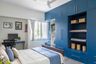 Spacious 4-Door Blue Swing Wardrobe Design With Drawer Units, Loft Storage And Open Shelves - Livspace