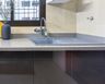 Spacious Modern Top Mount Kitchen Sink With Beige Countertop And Drainboard - Livspace