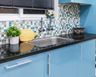 Spacious Stainless Steel Kitchen Sink With Undermount Single Bowl, Black Countertop And Blue Glossy Cabinets - Livspace