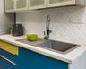 Top Mount Stainless Steel Sink With Blue And Yellow Kitchen Cabinets - Livspace