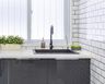 Single Bowl Grey Quartz Kitchen Sink With Grey Cabinets And White Countertop - Livspace