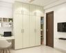 4-Door Swing Wardrobe Design In Champagne Tones With Open Shelves Unit And Integrated Study Unit - Livspace