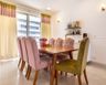 8-Seater Dining Room With A Wooden Tabletop - Livspace