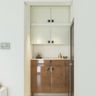 White And Brown Storage And Cabinets Foyer Design - Livspace