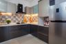 L-Shaped Kitchen Design With Multicolour Dado Tiles - Livspace